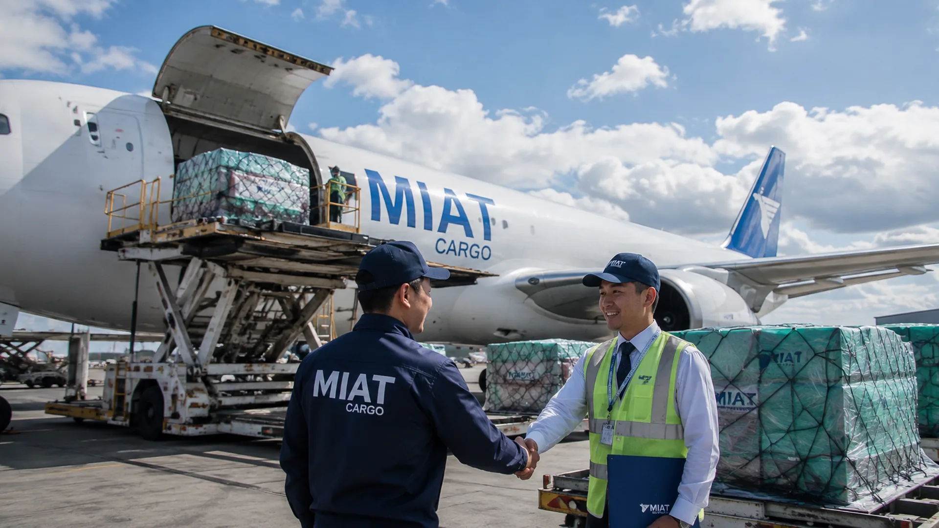 MIAT staff unloading cargo from the aircraft